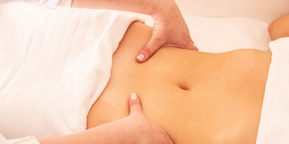 massaging abdomen image